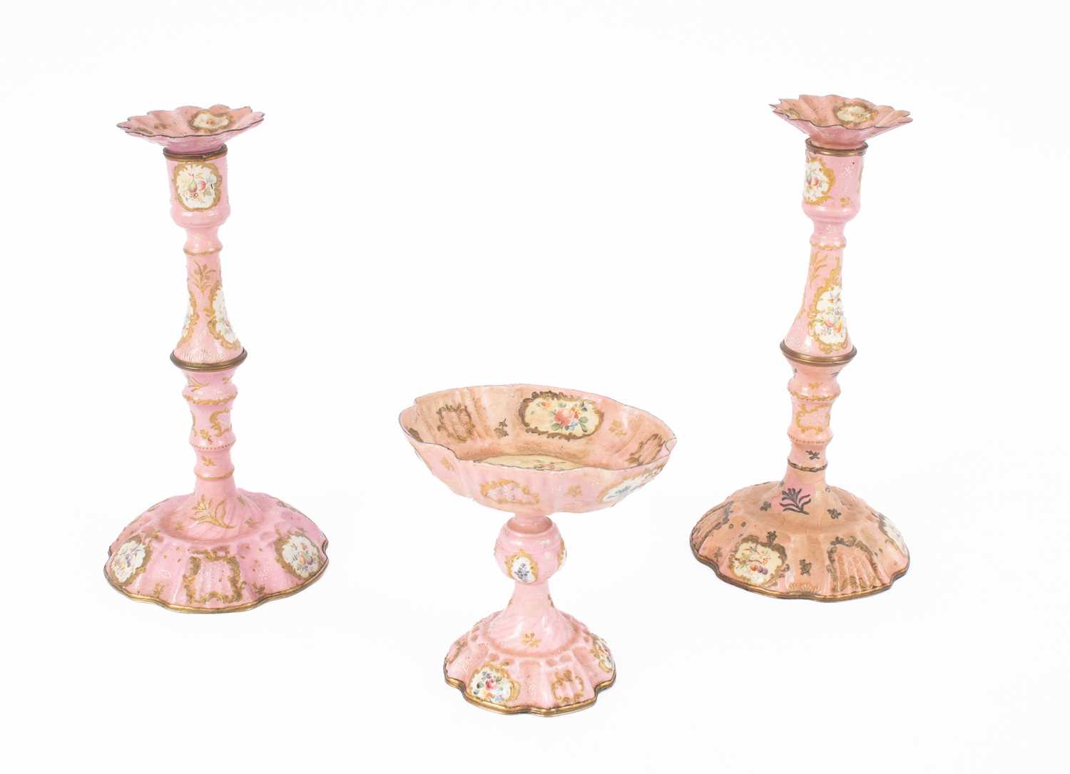 Lot 106 - A pair of Bilston pink enamel candlesticks
