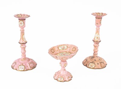 Lot 106 - A pair of Bilston pink enamel candlesticks