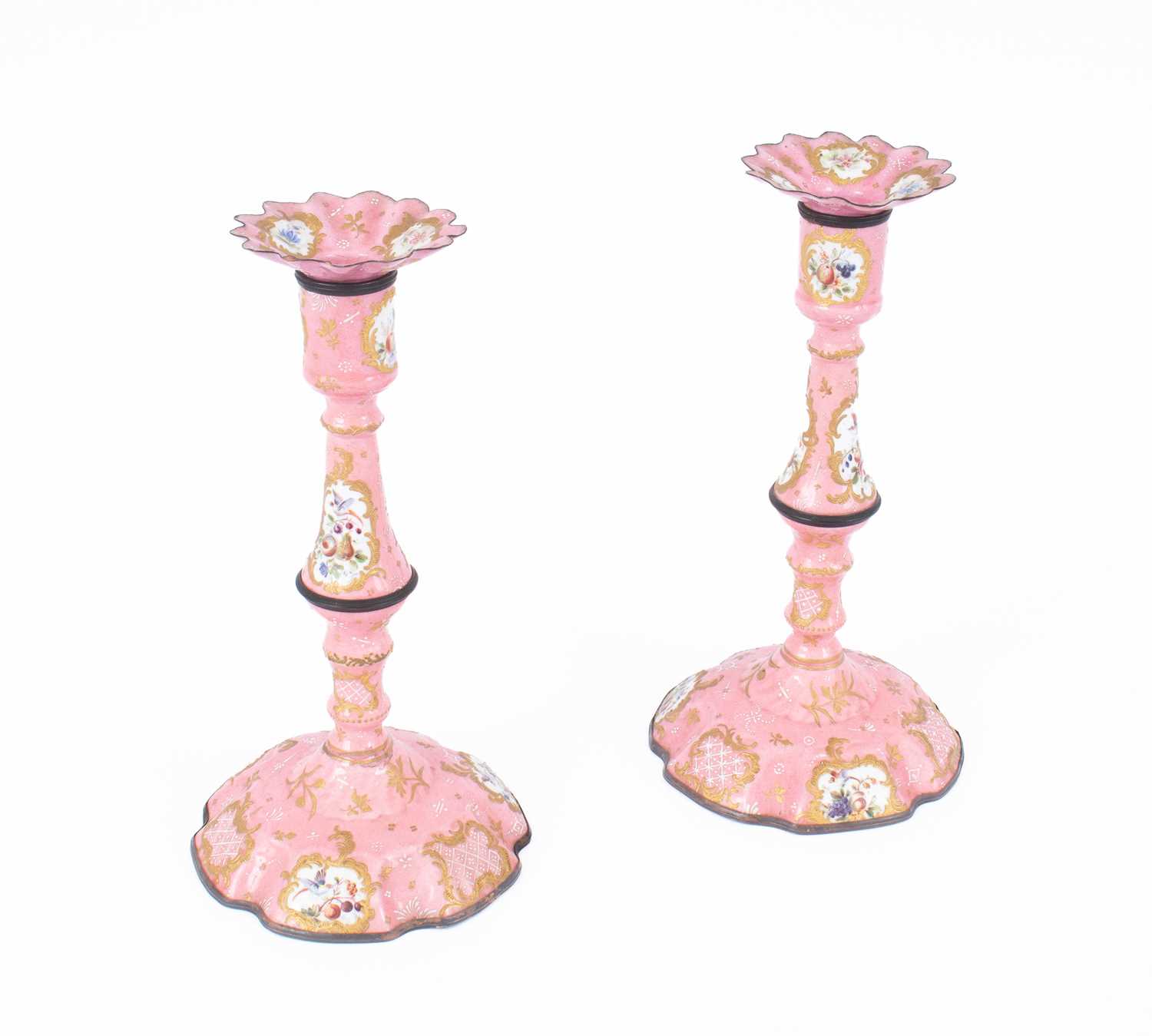 Lot 107 - A pair of Bilston enamel candlesticks