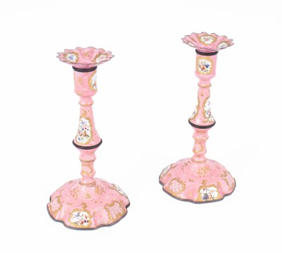 Lot 107 - A pair of Bilston enamel candlesticks