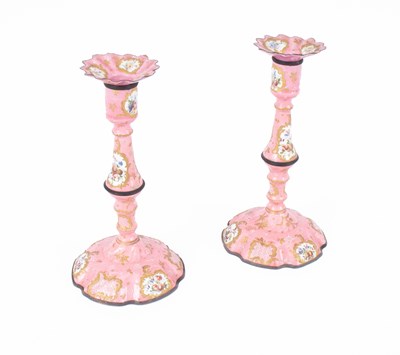 Lot 107 - A pair of Bilston enamel candlesticks