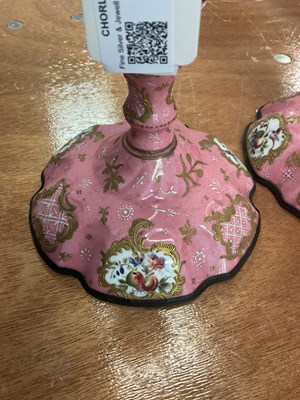 Lot 107 - A pair of Bilston enamel candlesticks