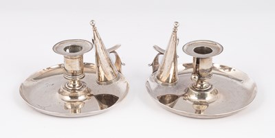 Lot 17 - A closely matched pair of Scottish silver chamber candlesticks