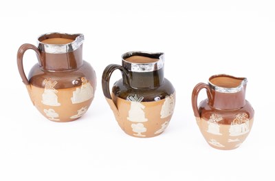 Lot 849 - Three graduated Doulton Lambeth stoneware jugs