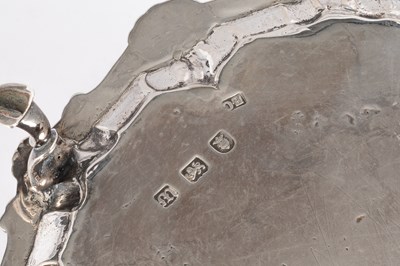 Lot 74 - A George III silver card waiter
