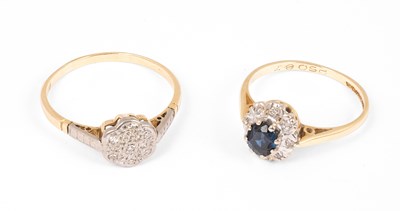 Lot 156 - An early 20th Century yellow metal and diamond flower head ring
