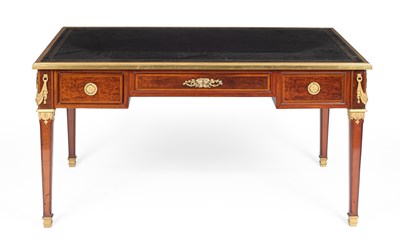 Lot 364 - A Louis XVI style walnut bureau plat