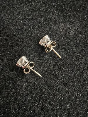 Lot 211 - An impressive pair of diamond single stone stud earrings