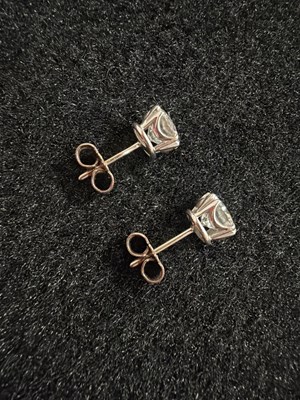 Lot 211 - An impressive pair of diamond single stone stud earrings