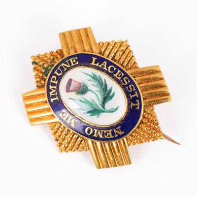 Lot 161 - A yellow metal and enamel Scots Guards brooch