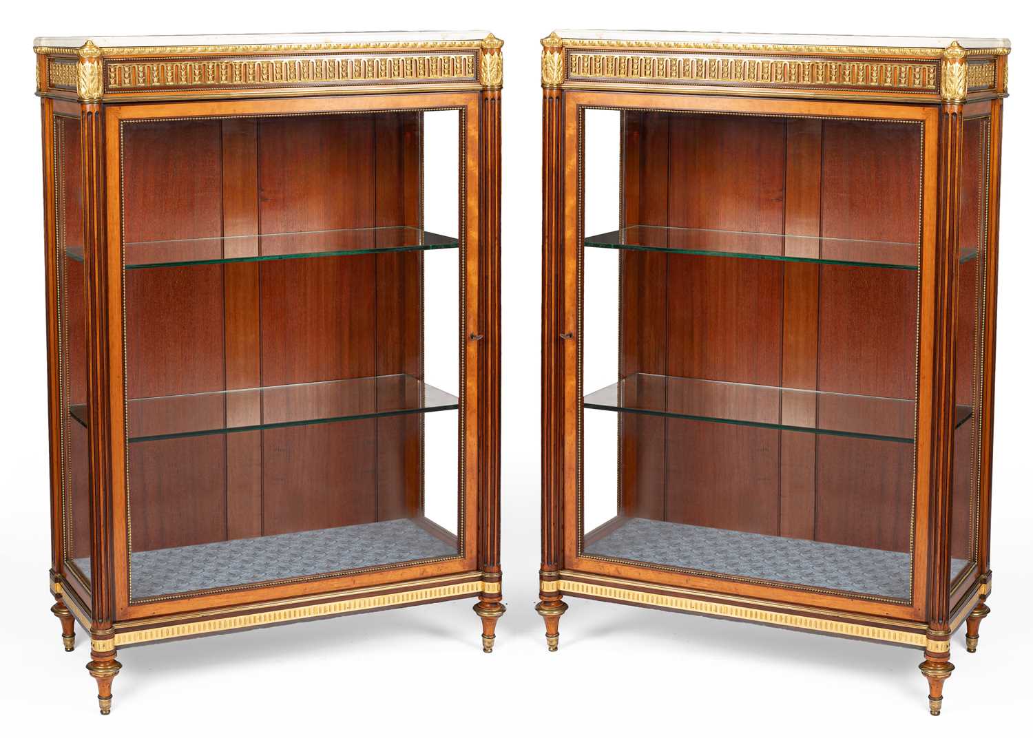 Lot 369 - A pair of Louis XVI style ormolu mounted bois satine and amaranth display cabinets
