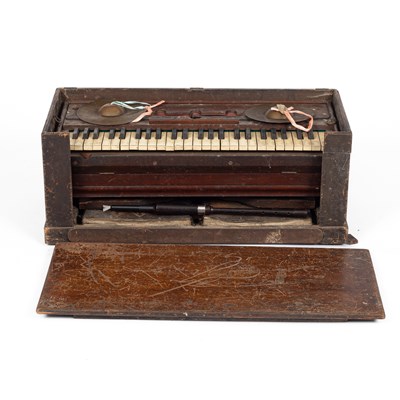 Lot 935 - A cased travelling or portable Harmonium
