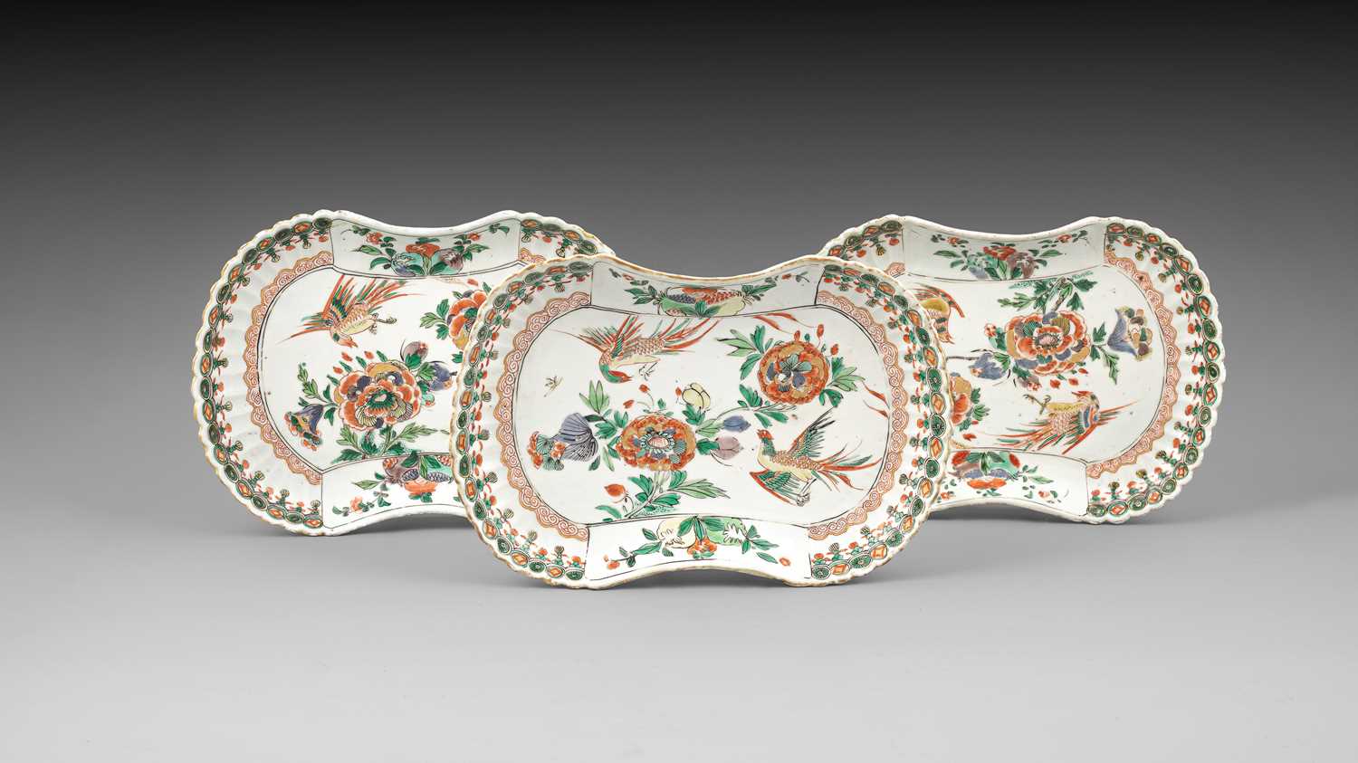 Lot 298 - A set of three rare Chinese famille verte moulded rounded-oblong dishes