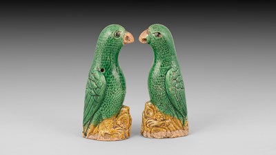 Lot 301 - A pair of small Chinese export green and yellow glazed parrots