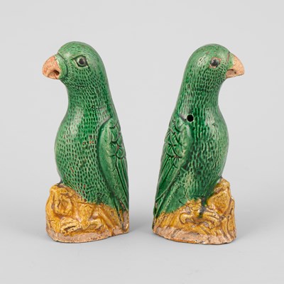 Lot 301 - A pair of small Chinese export green and yellow glazed parrots