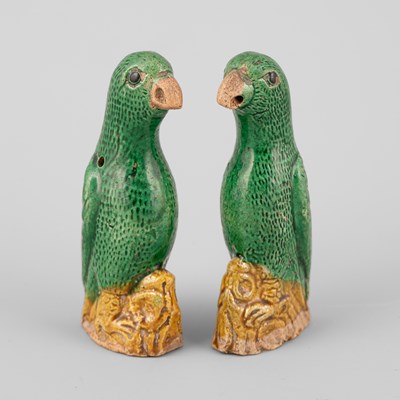 Lot 301 - A pair of small Chinese export green and yellow glazed parrots