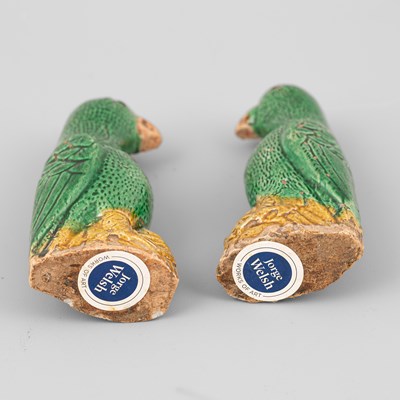 Lot 301 - A pair of small Chinese export green and yellow glazed parrots
