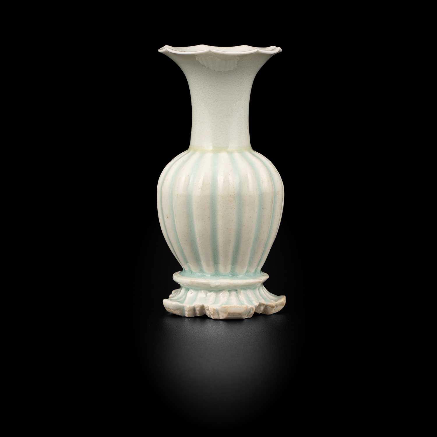 Lot 302 - A small Qingbai fluted baluster vase