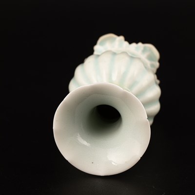 Lot 302 - A small Qingbai fluted baluster vase