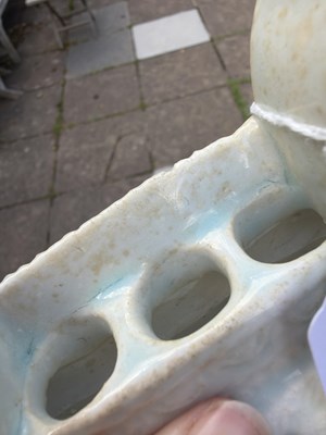 Lot 303 - A small Qingbai porcelain animal form brush holder