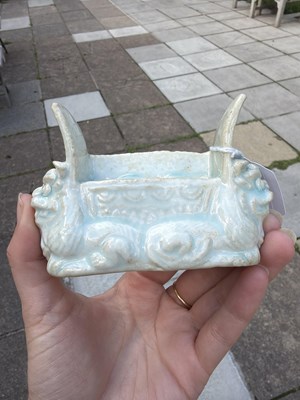 Lot 303 - A small Qingbai porcelain animal form brush holder
