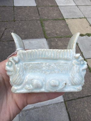 Lot 303 - A small Qingbai porcelain animal form brush holder