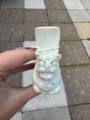 Lot 303 - A small Qingbai porcelain animal form brush holder
