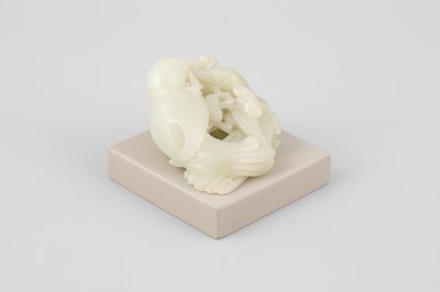 Lot 307 - A pale celadon jade bird group