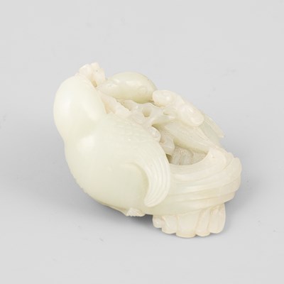 Lot 307 - A pale celadon jade bird group