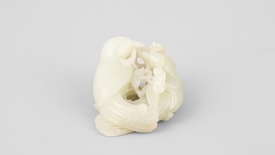 Lot 307 - A pale celadon jade bird group