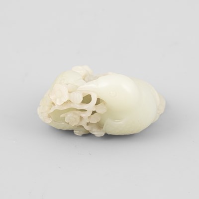 Lot 307 - A pale celadon jade bird group