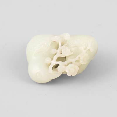Lot 307 - A pale celadon jade bird group