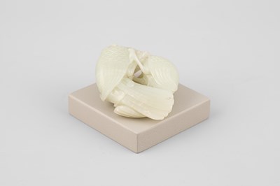Lot 307 - A pale celadon jade bird group