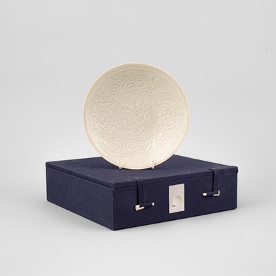 Lot 313 - A Qingbai moulded floral saucer dish