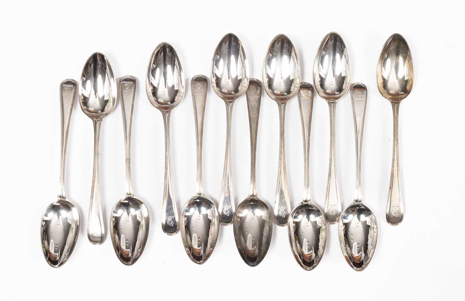 Lot 64 - A set of twelve George III thread pattern silver tablespoons