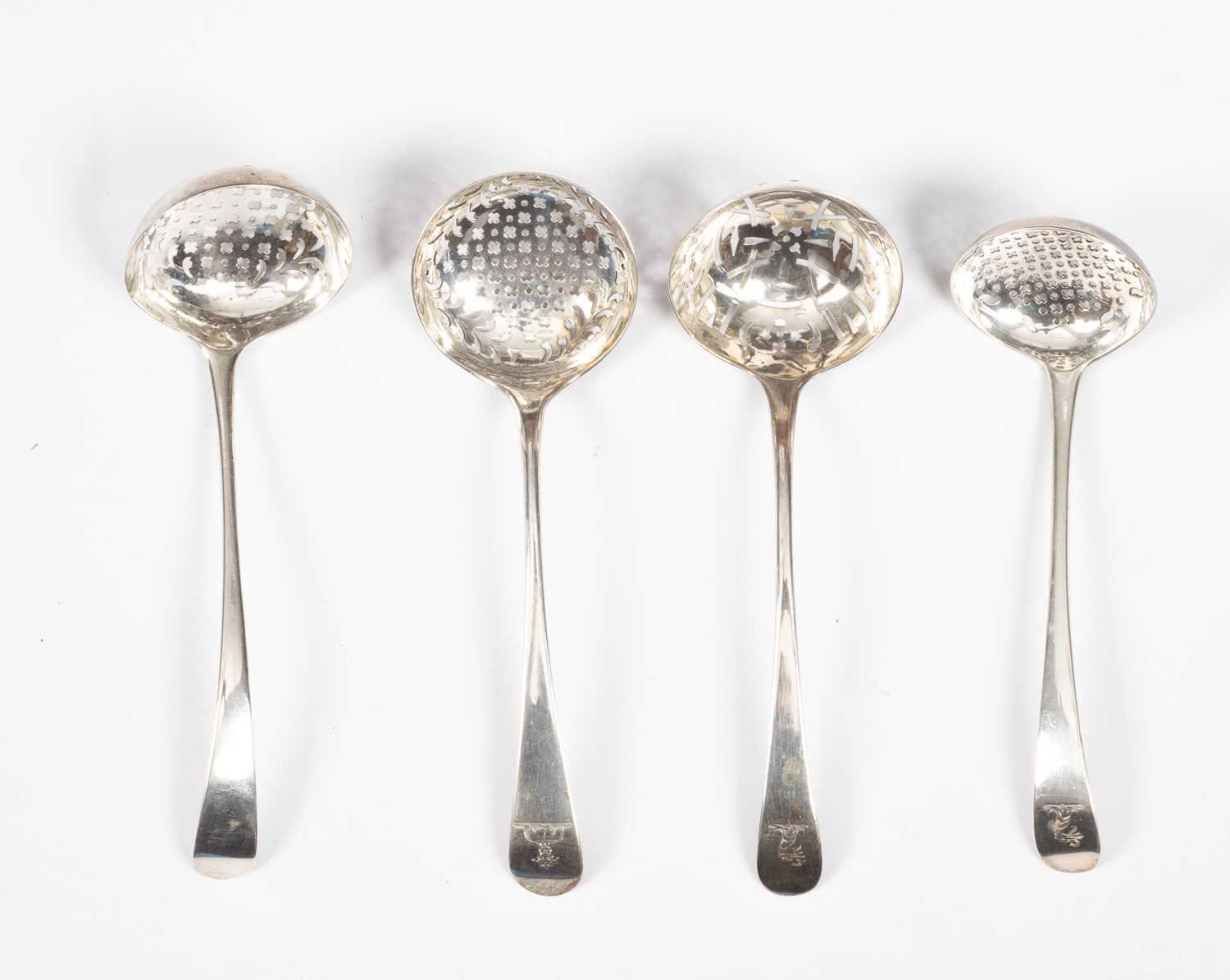 Lot 69 - Four Georgian silver sifter ladles