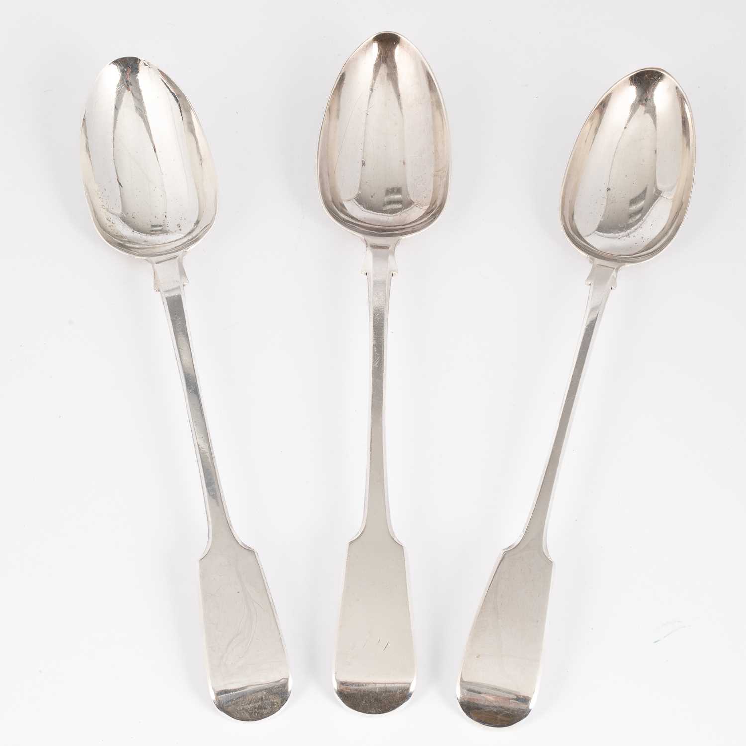 Lot 8 - Three Georgian and later fiddle pattern silver basting spoons