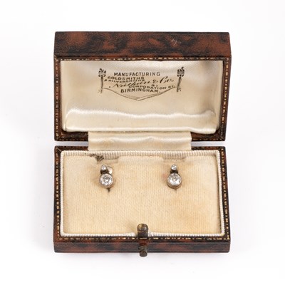 Lot 170 - A pair of yellow metal and diamond set screw back earrings