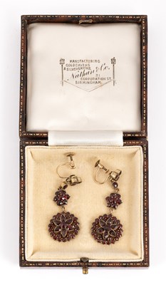Lot 173 - A pair of Victorian gilt metal and garnet drop earrings