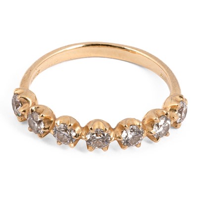 Lot 180 - An 18ct yellow gold and diamond seven stone ring