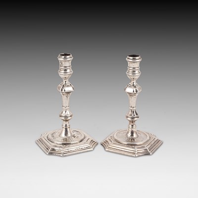 Lot 394 - A pair of George II silver tapersticks