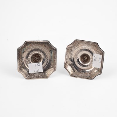 Lot 394 - A pair of George II silver tapersticks