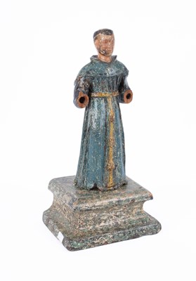 Lot 677 - A carved and polychrome Santos figure