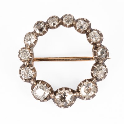 Lot 185 - A late Georgian yellow metal circular diamond brooch