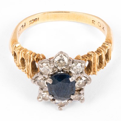 Lot 191 - A yellow metal sapphire and diamond cluster ring