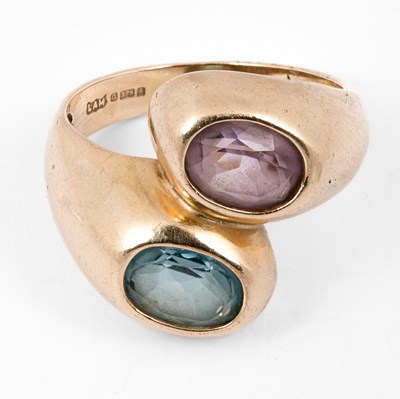 Lot 118 - An amethyst and blue topaz crossover ring