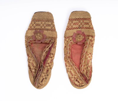 Lot 950 - A pair of children's straw work shoes
