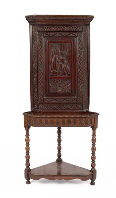 Lot 321 - A Victorian carved oak corner cupboard