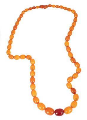 Lot 125 - A single row of graduated oval Baltic amber beads