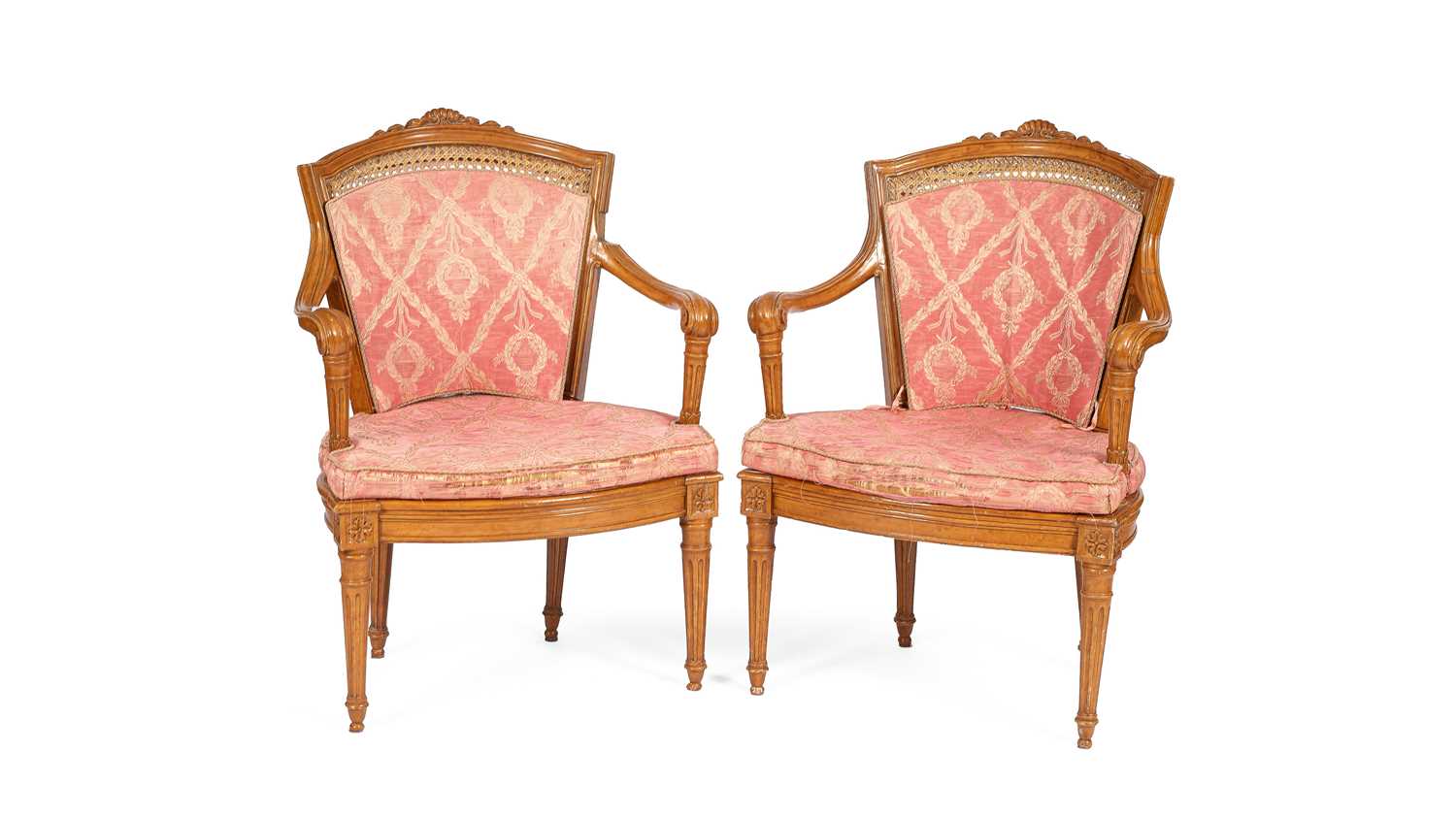 Lot 381 - A pair of French painted and carved open armchairs